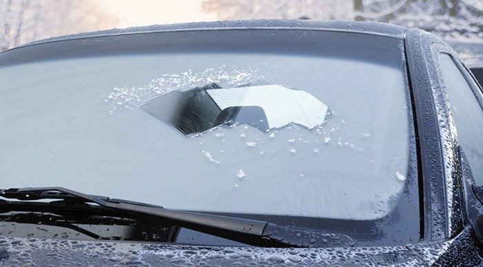 Remove snow from the windshield using