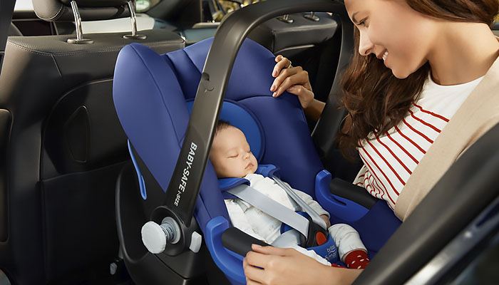 Is it possible to carry a child in a car seat on front passenger seat? 